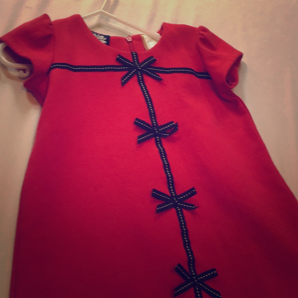 Three red dresses with bows